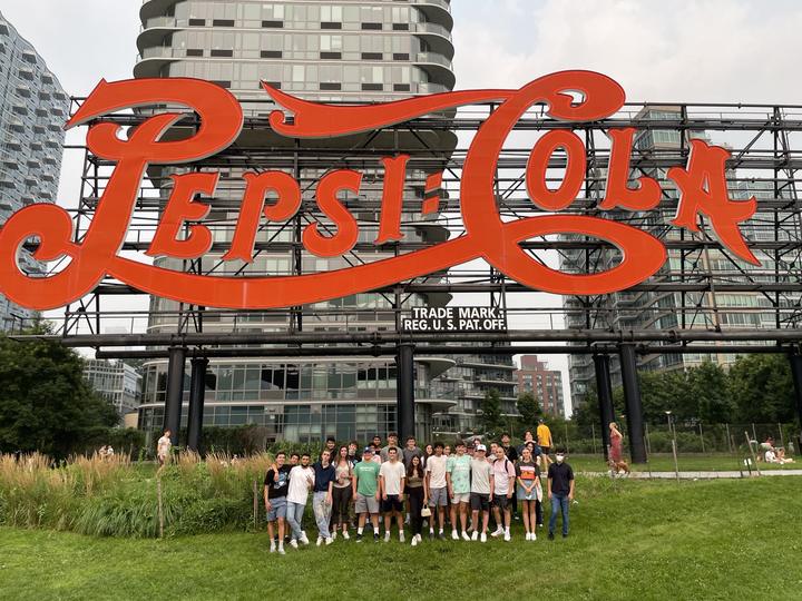 The group under the Pepsi-Cola sign in Long Island City